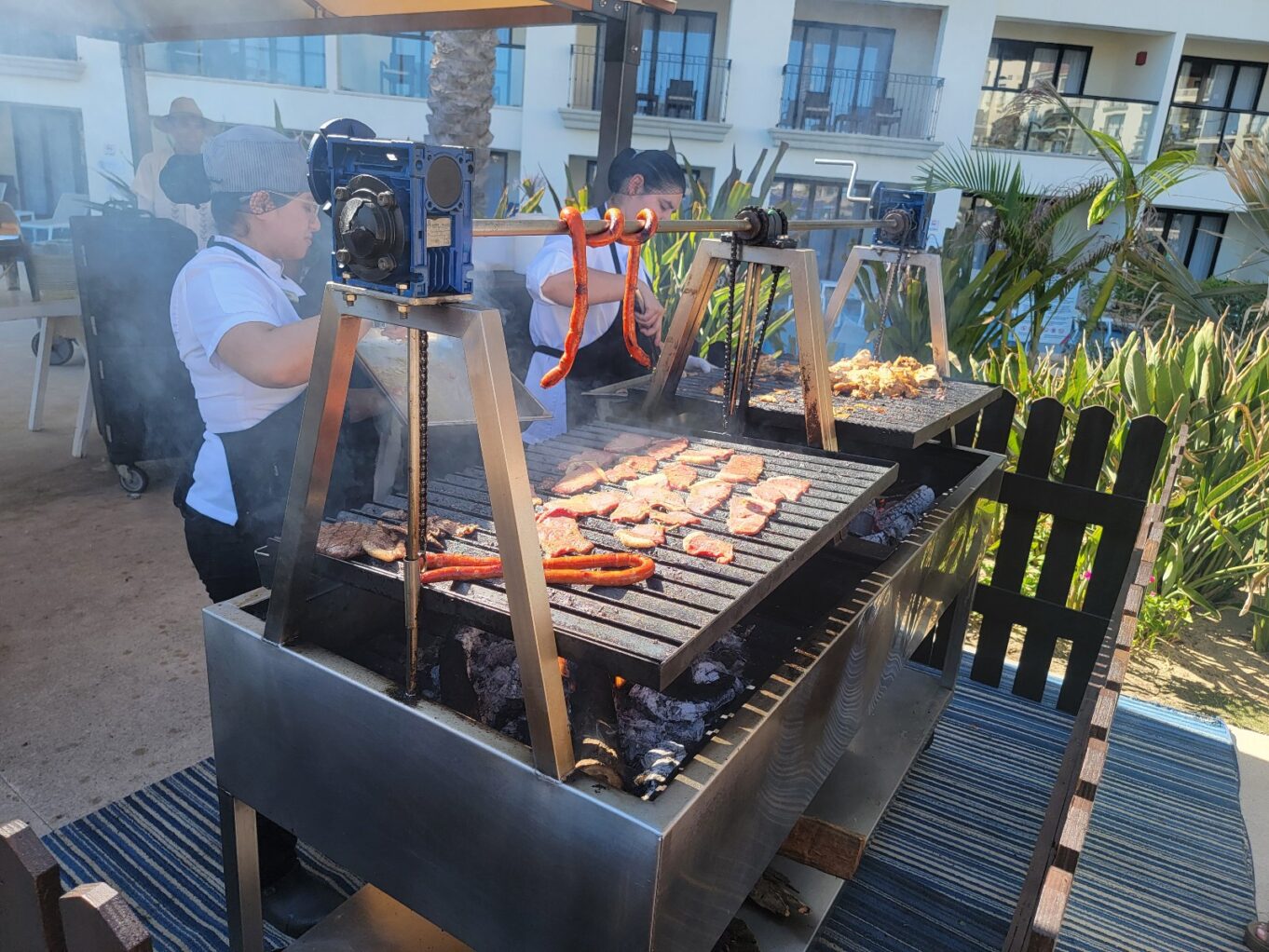 a person cooking food on a grill