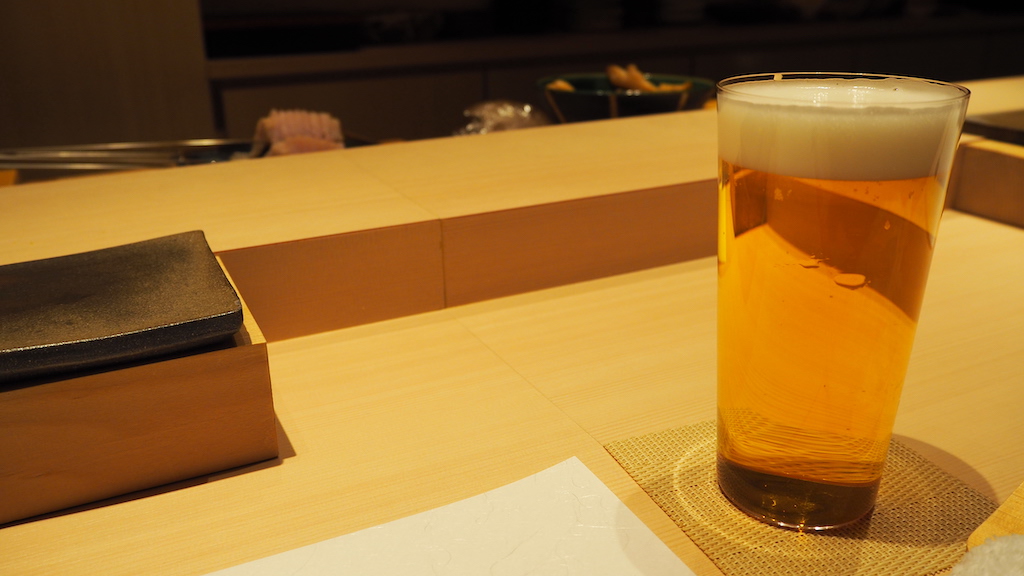 a glass of beer on a table