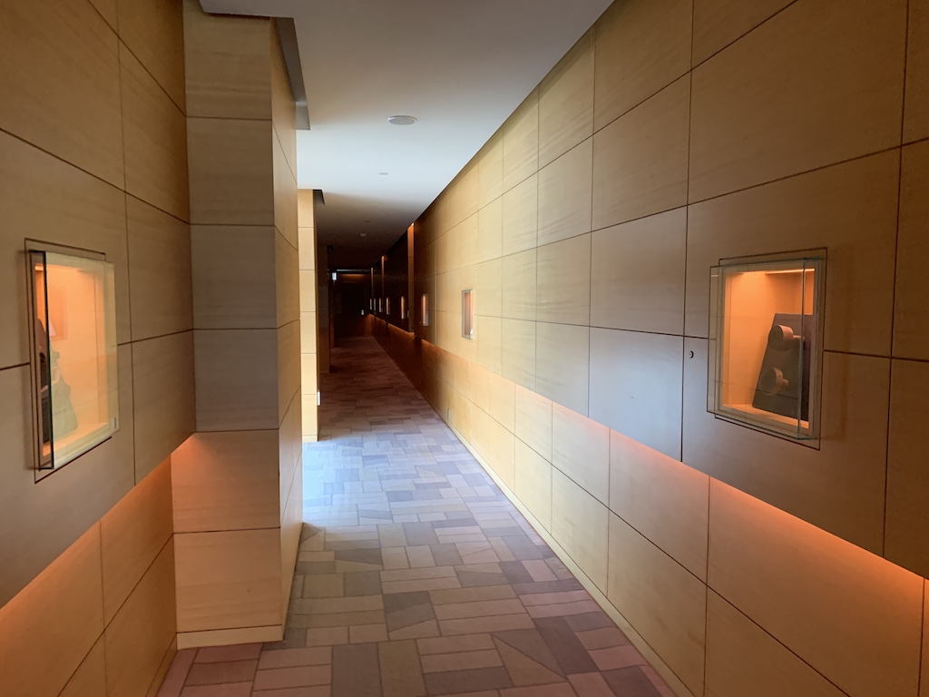 a hallway with a tile floor