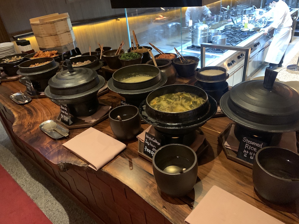 a table with many pots and pans on it