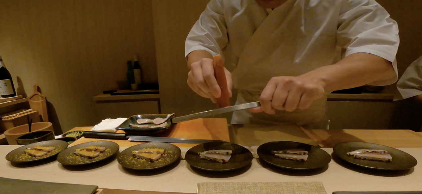 a chef preparing food on a table