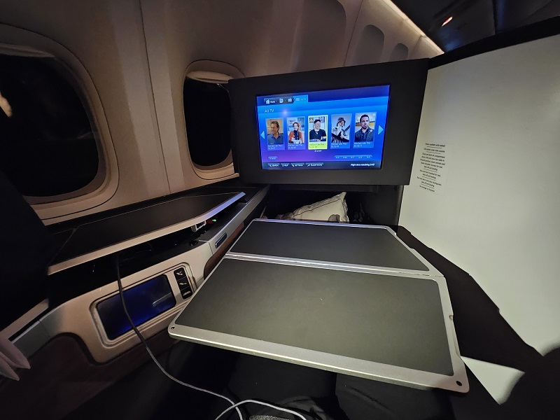 a couple of electronic devices on a plane