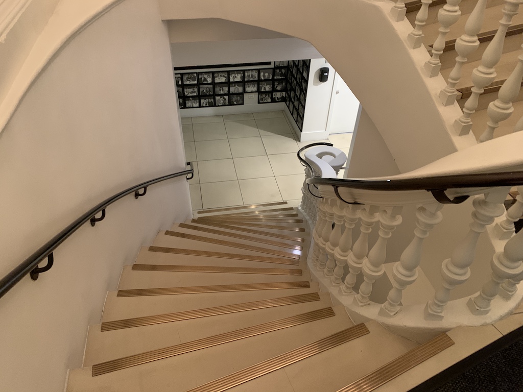 a staircase with a toilet