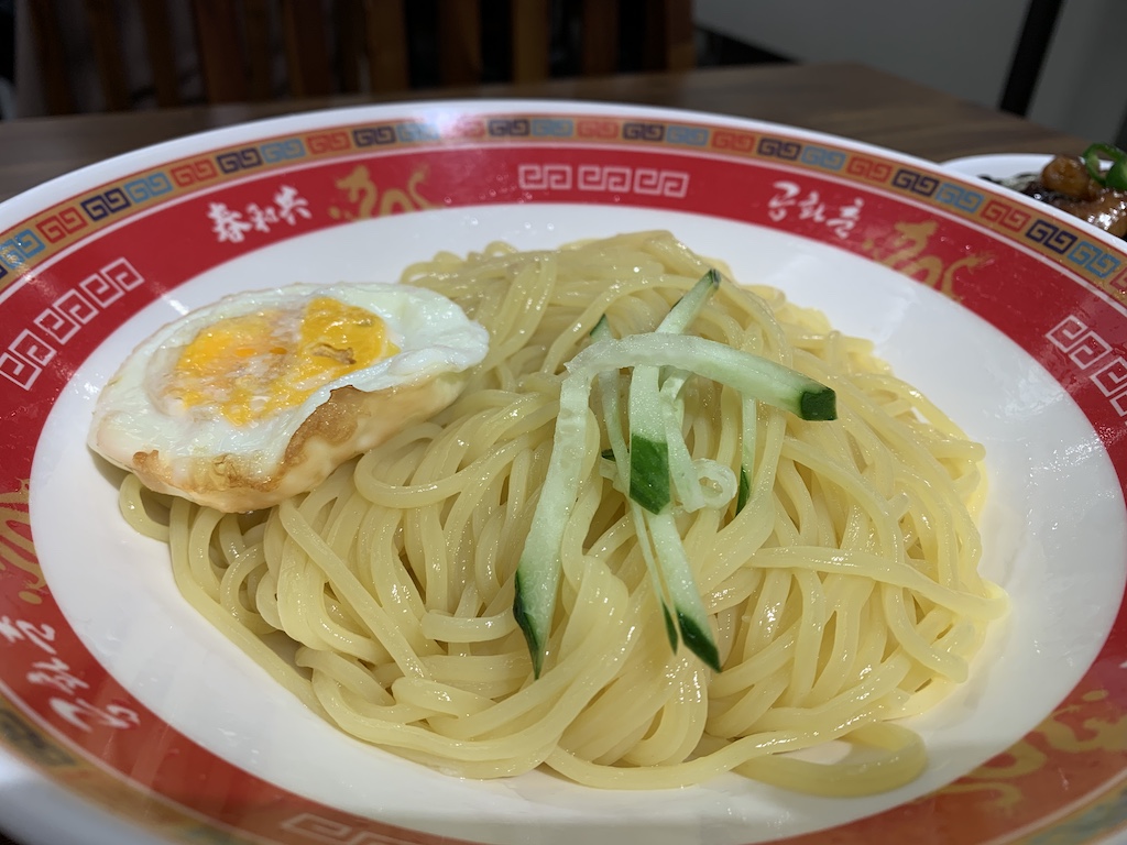 a bowl of ramen with an egg on top