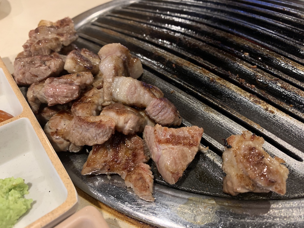 a grill with meat on it