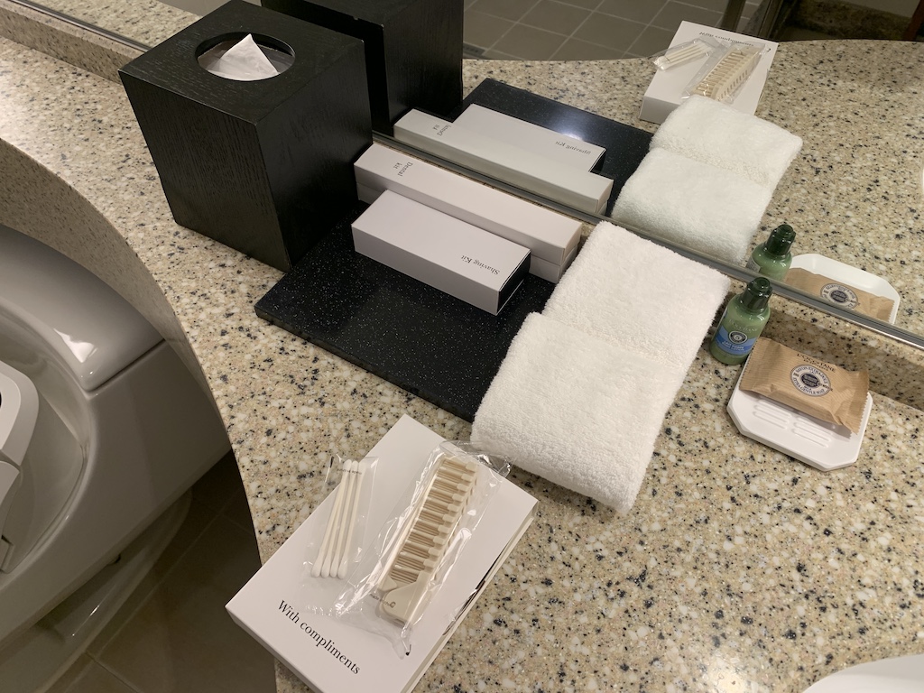 a counter top with a couple of boxes and a couple of bottles of soap on it