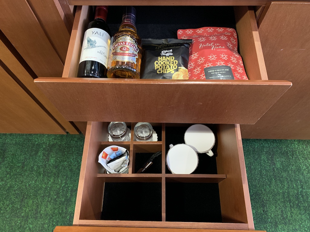 a shelf with bottles and objects on it