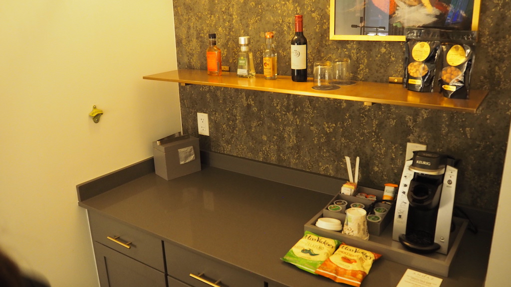 a kitchen counter with a coffee maker and other objects on it