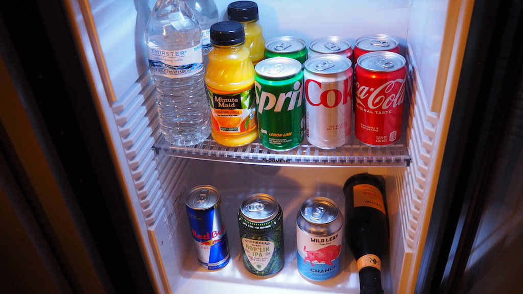 a fridge with drinks and bottles