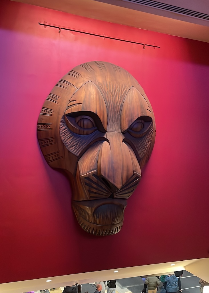 a wooden mask on a wall