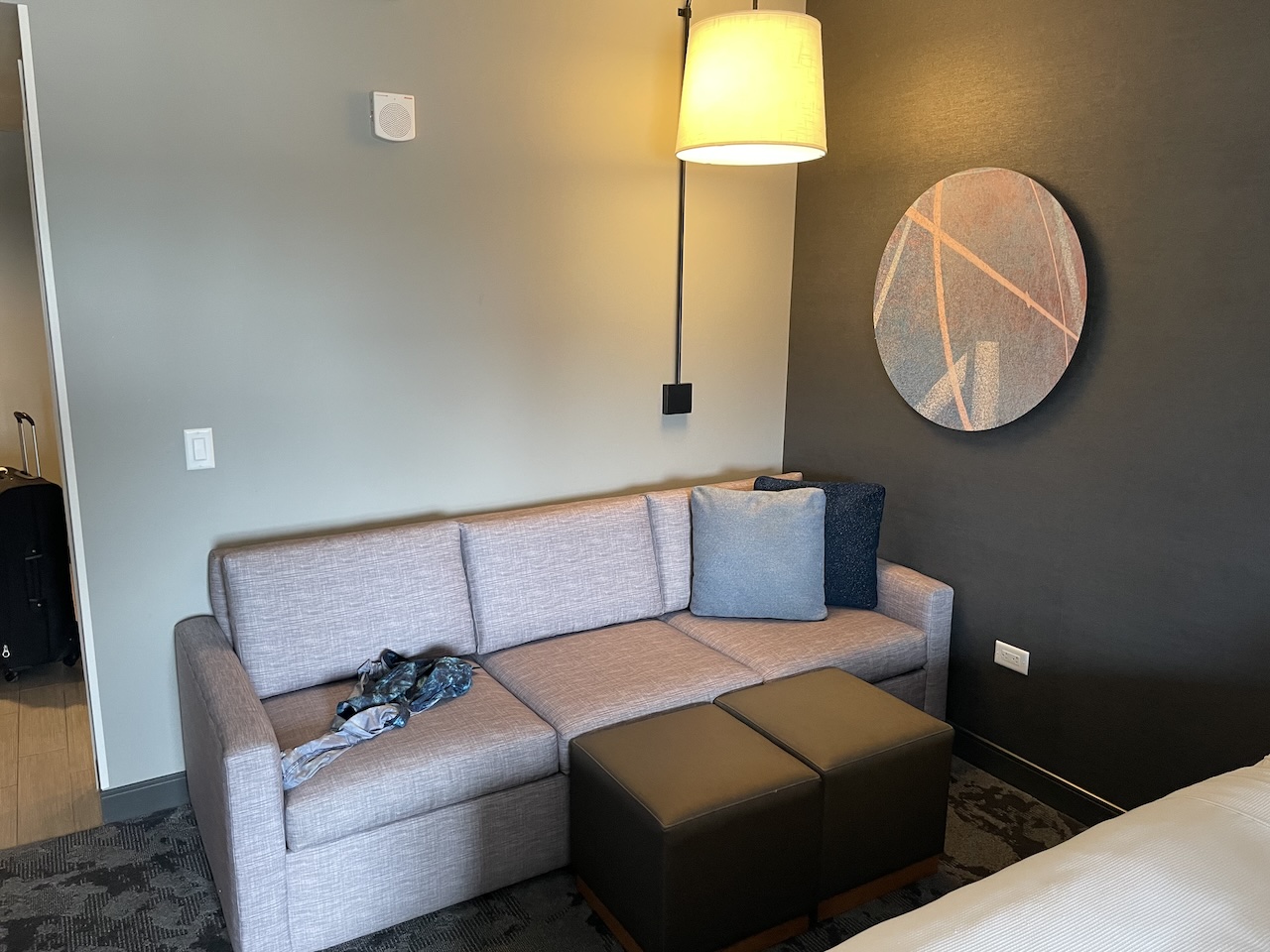 a couch and a lamp in a room