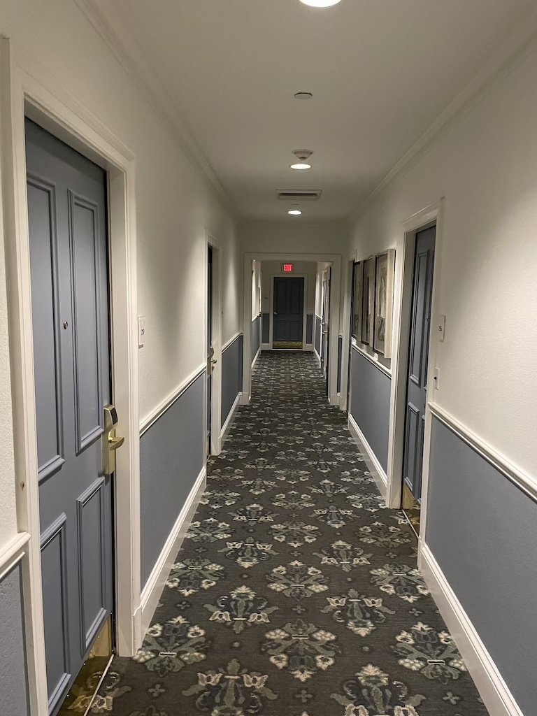 a hallway with doors and windows