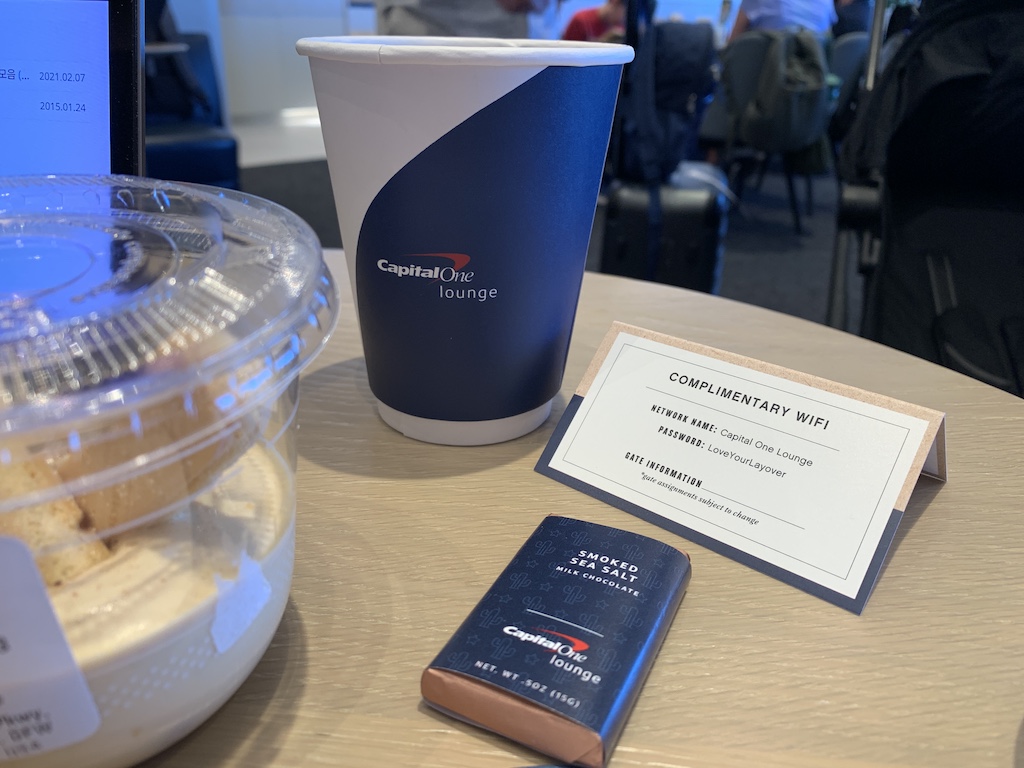 a blue cup and a book on a table