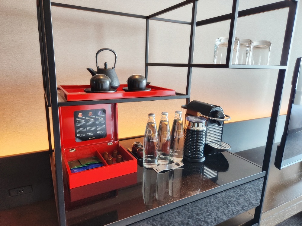 a kitchen counter with a coffee maker and a coffee maker