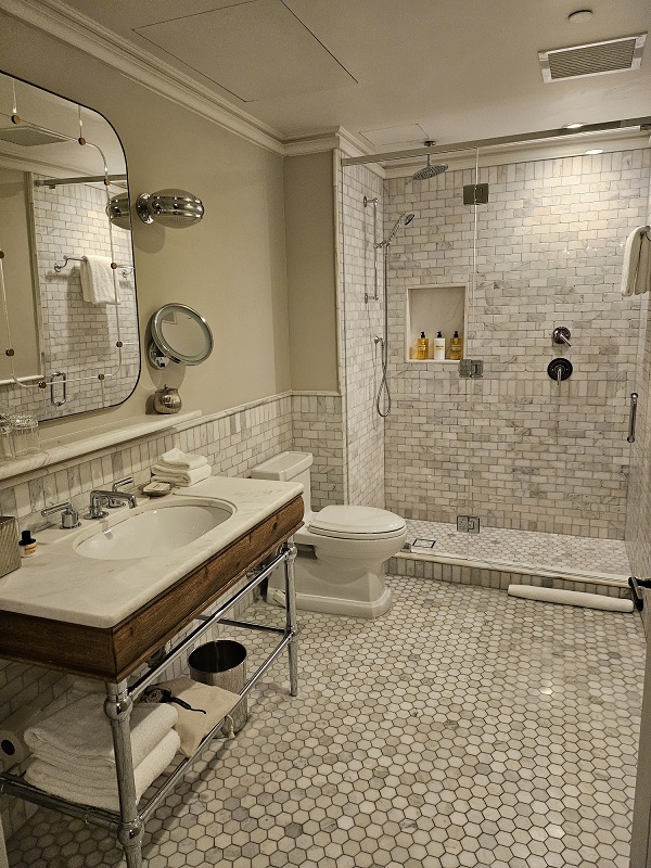 a bathroom with a sink toilet and mirror