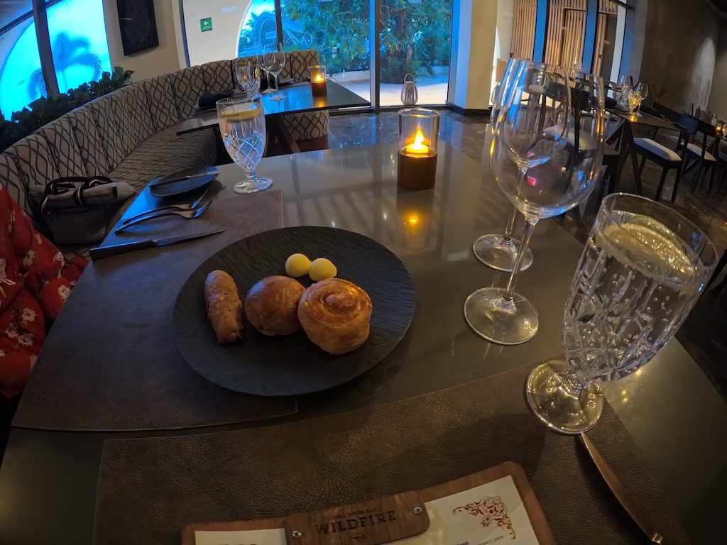 a plate of food and wine glasses