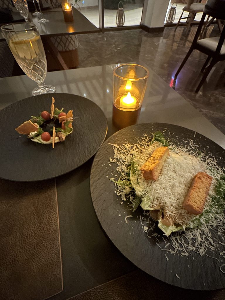 a plate of food and a candle on a table