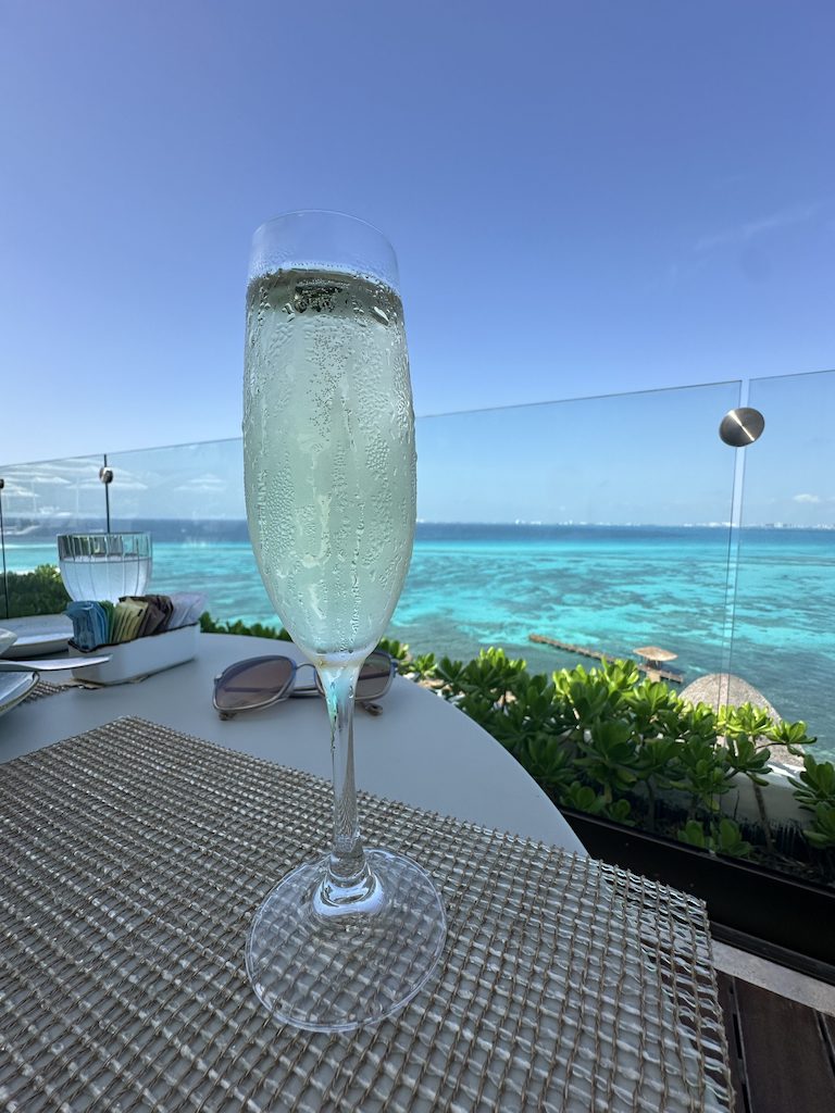 a glass of champagne on a table