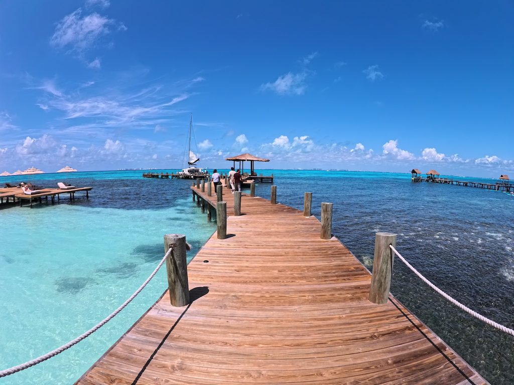 a dock with a boat in the water