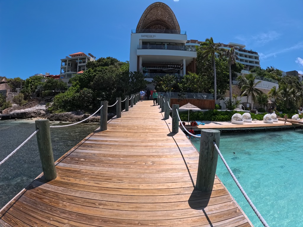 a wooden dock leading to a building