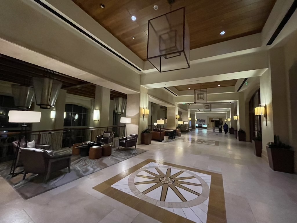 a large room with a large white floor and a large circular rug