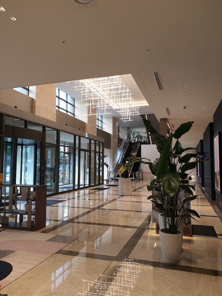 a large indoor courtyard with a plant