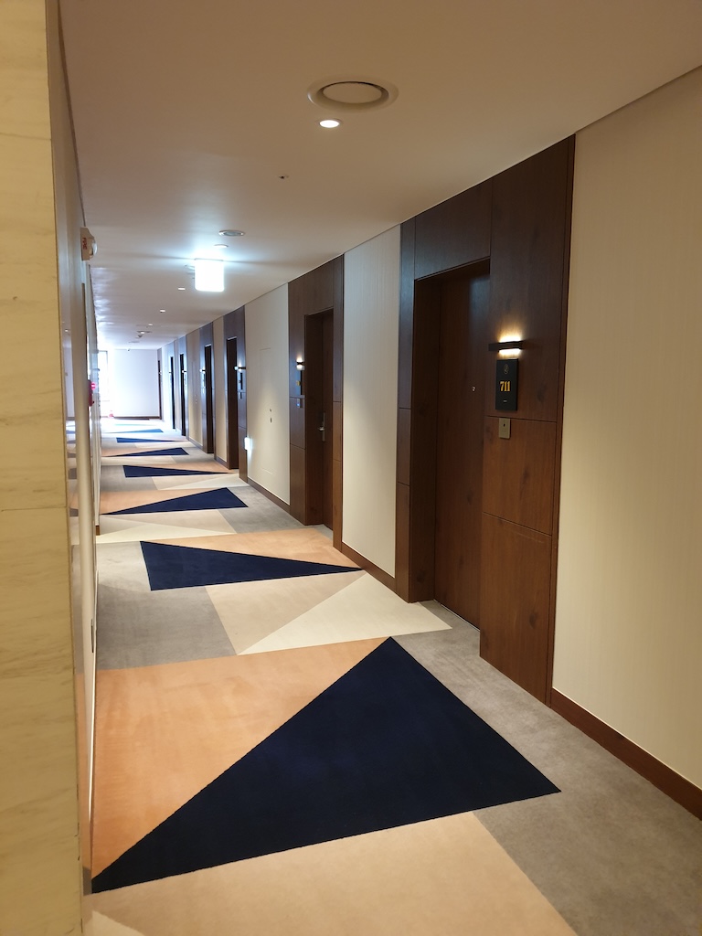 a hallway with a rug