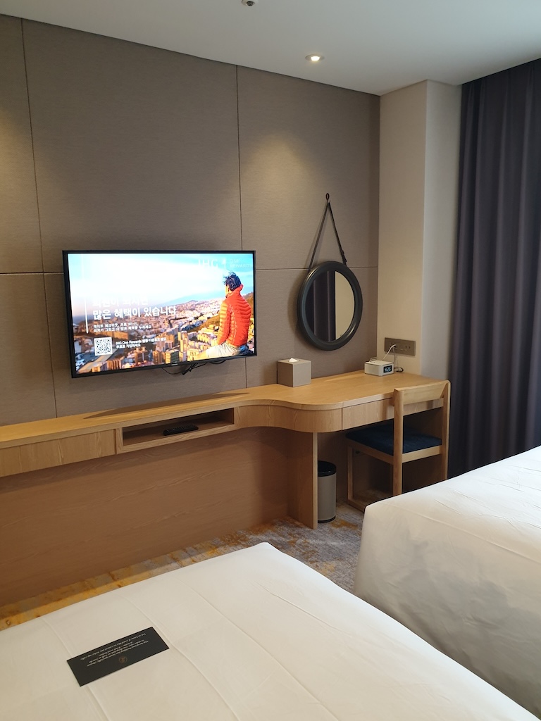 a room with a tv and a bed