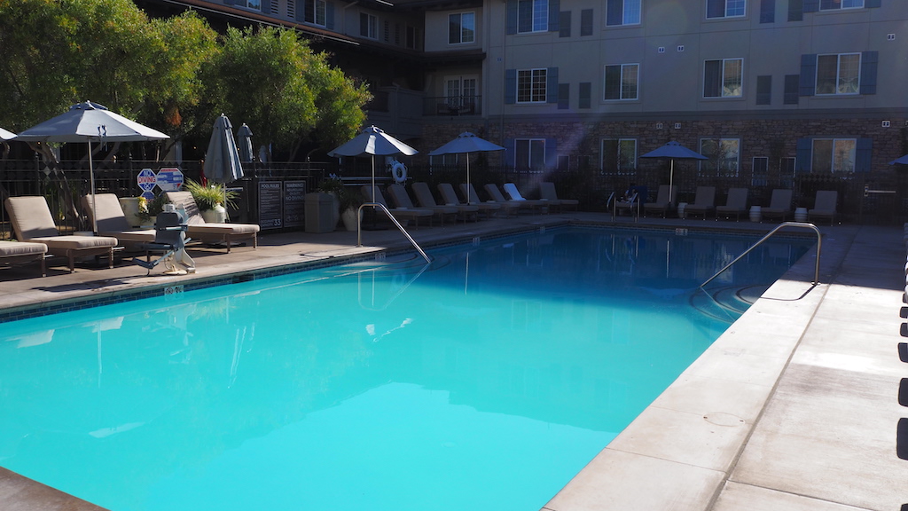 a pool with chairs around it