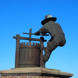 a statue of a man holding a gun