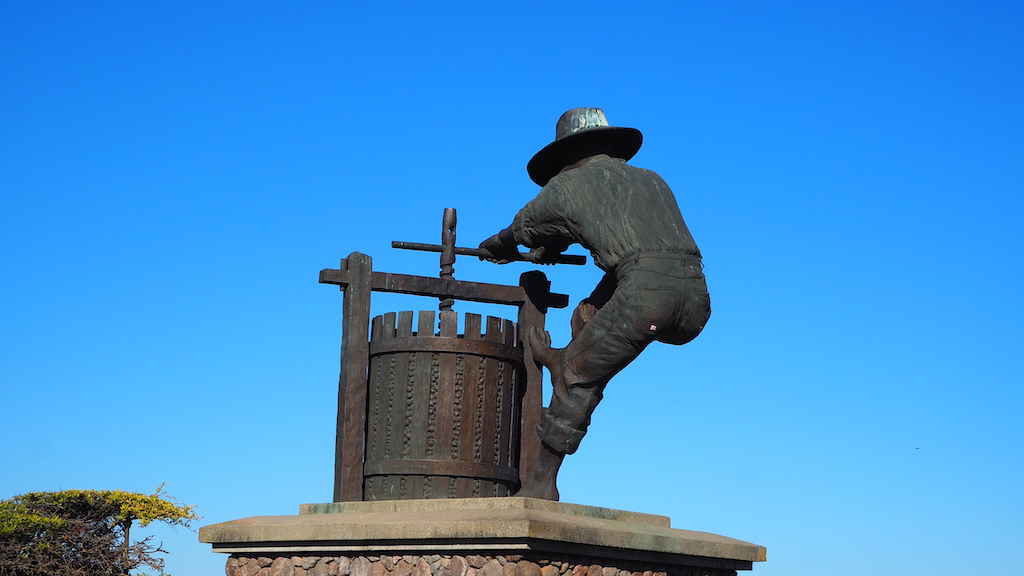 a statue of a man holding a gun