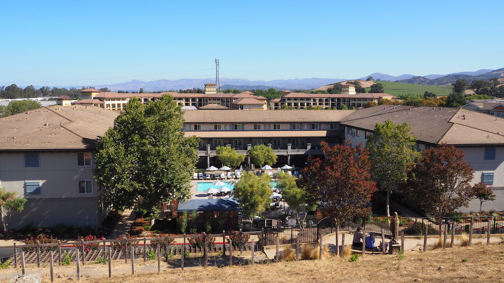 a group of buildings with trees in front of them