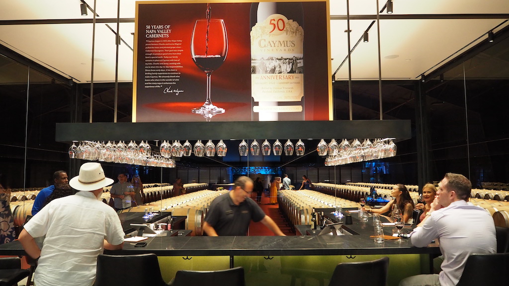 a group of people sitting at a table with wine glasses