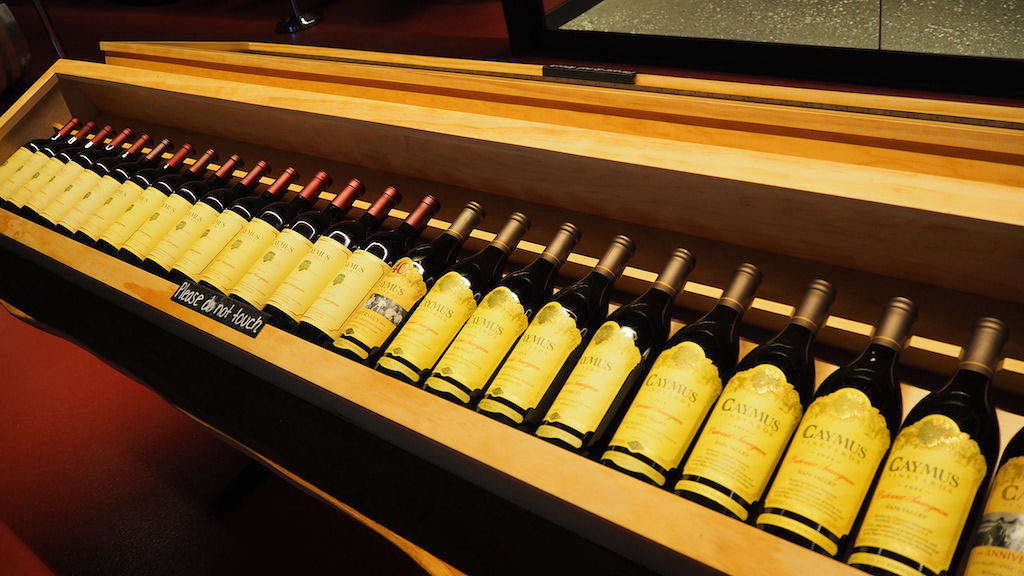 a shelf with bottles of wine on it