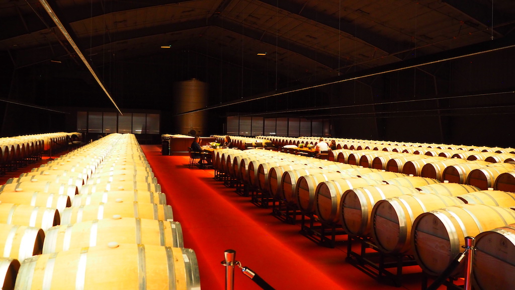 a large room with barrels