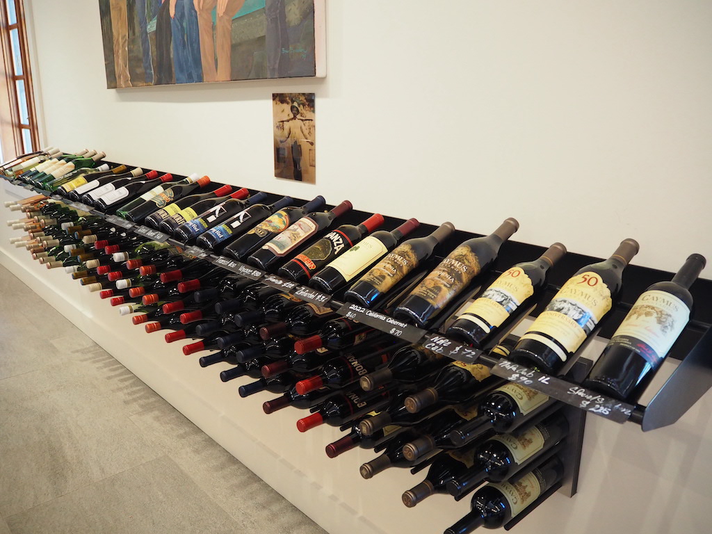 a large collection of wine bottles