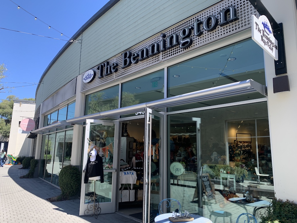 a store front with a person standing in the window