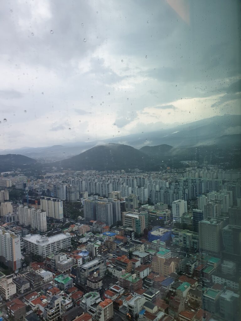 a city with mountains in the background