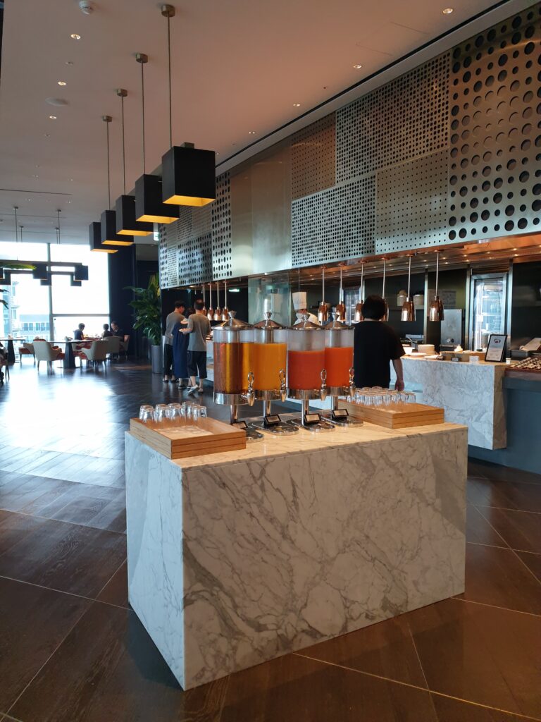 a large room with a counter and a large display of glasses