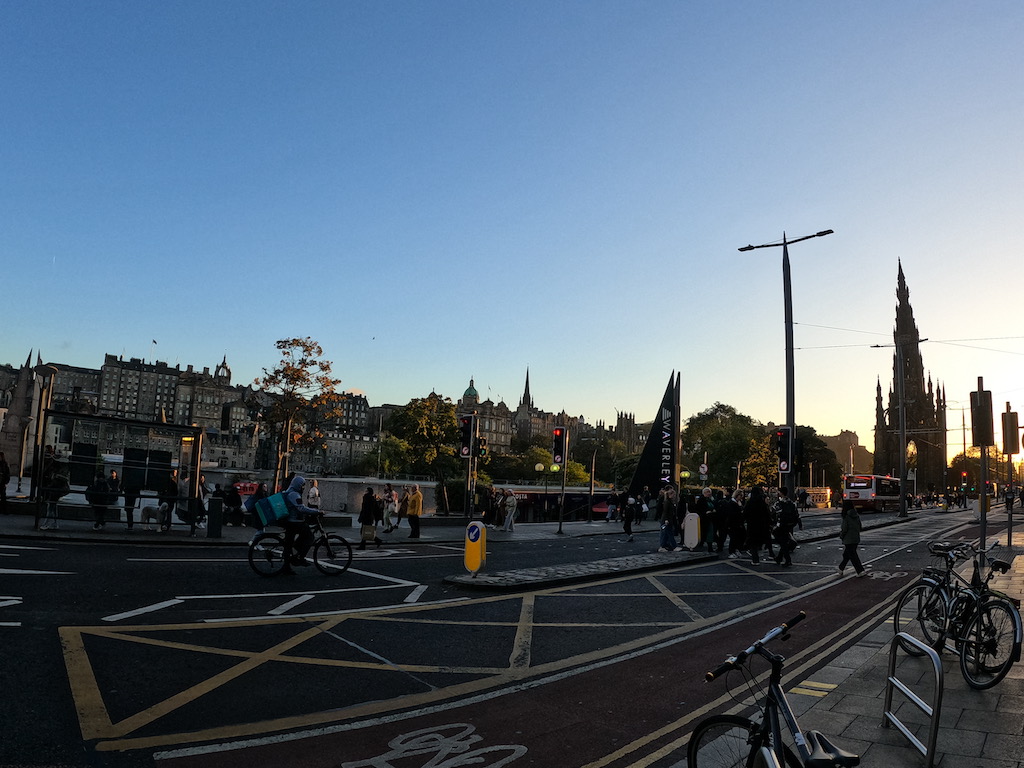 a group of people riding bikes on a street