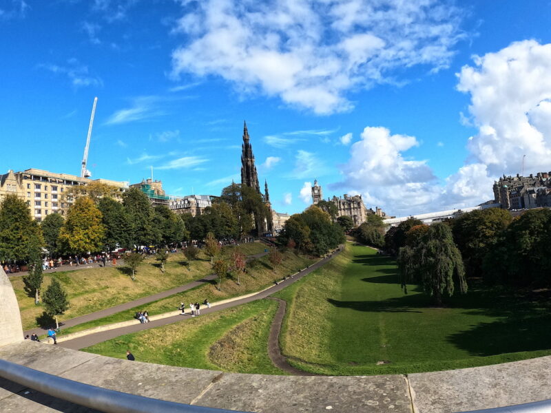 a park with a castle in the background