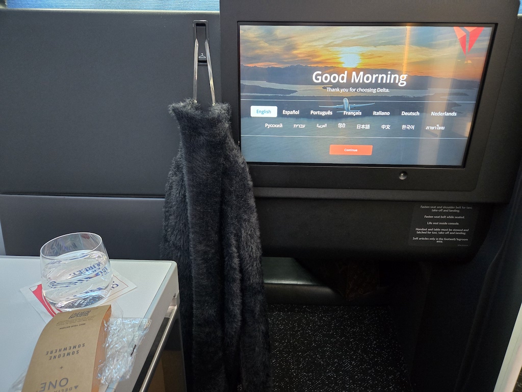 a knitted hat on a chair in front of a television