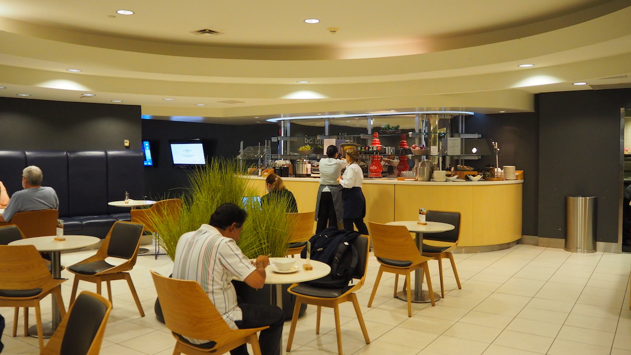 people sitting at tables in a restaurant