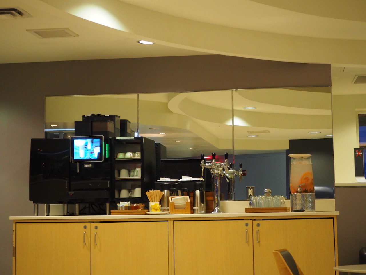 a room with a tv and cabinets