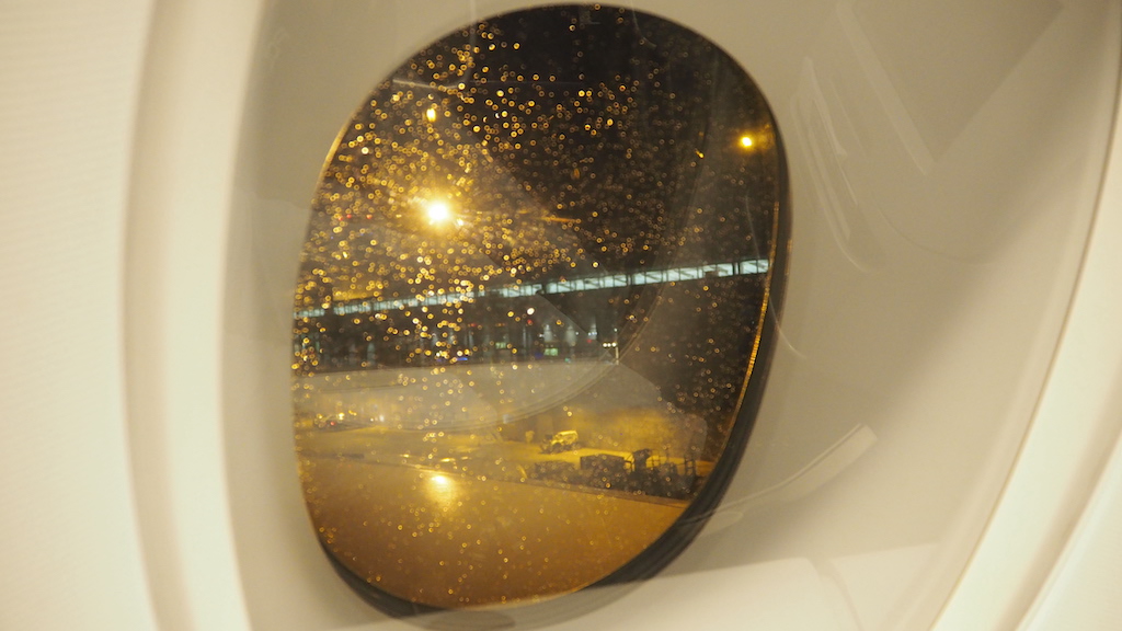 a view of a field through an airplane window