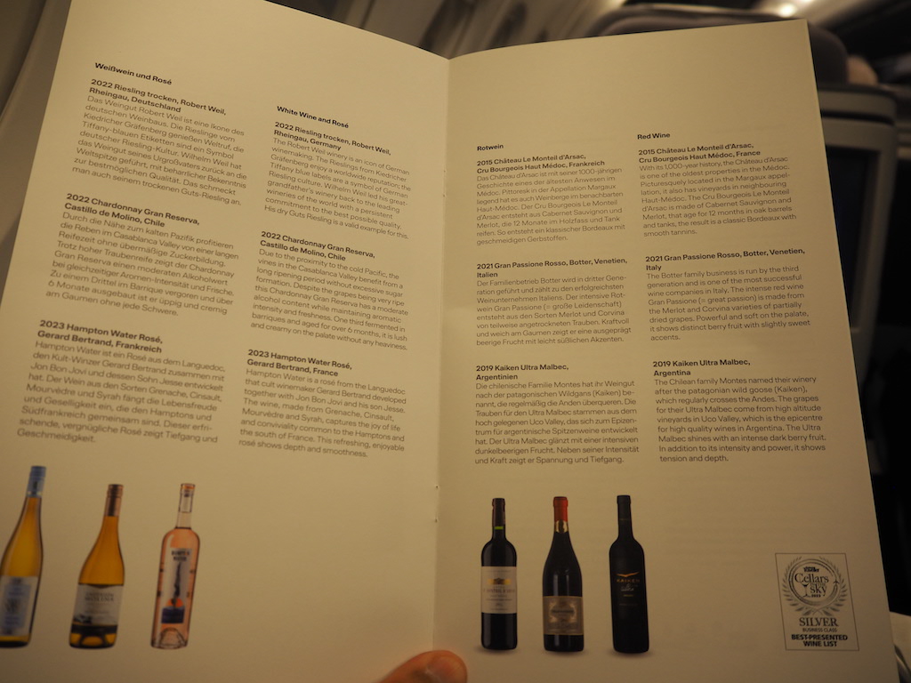 a book open with bottles of wine