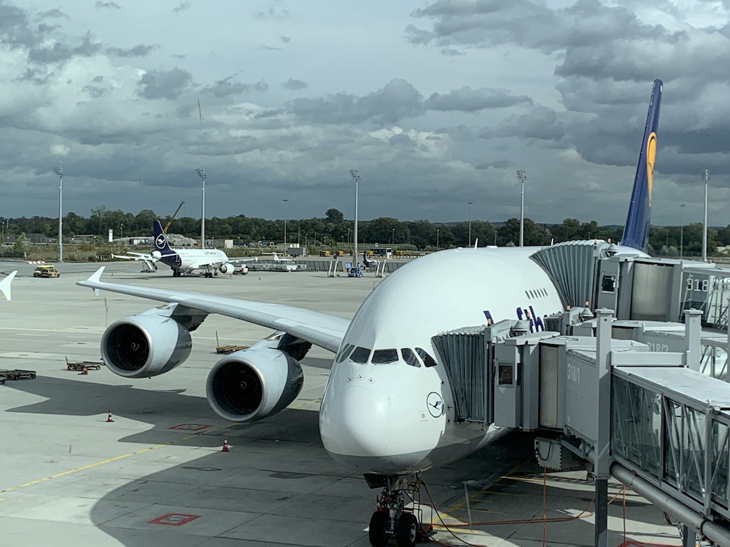 a large white airplane at an airport