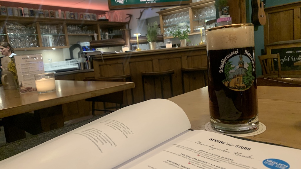 a glass of beer on a table