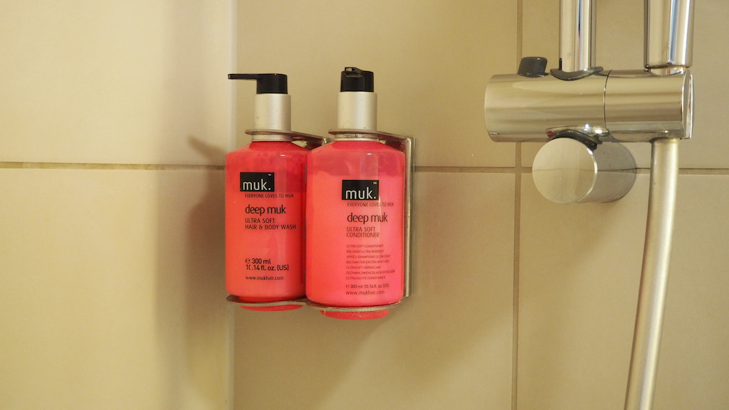 two bottles of shampoo on a shelf