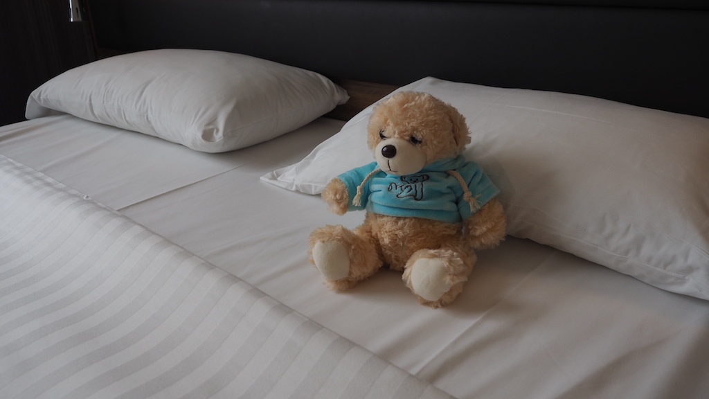 a teddy bear on a bed